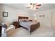 Comfortable primary bedroom with soft carpet, wooden furniture, and a ceiling fan at 210 35Th Ne Ave, Hickory, NC 28601