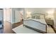 Bright and airy bedroom featuring hardwood floors, a comfortable bed, and ample closet space at 2101 Dilworth W Rd, Charlotte, NC 28203