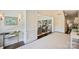 Inviting foyer with a crystal chandelier, leading into a living area with comfortable seating at 2101 Dilworth W Rd, Charlotte, NC 28203