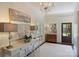 Welcoming foyer featuring a decorative table, chandelier, and stylish artwork at 2101 Dilworth W Rd, Charlotte, NC 28203