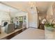 Bright foyer with elegant chandelier, flows into a cozy living space with fireplace at 2101 Dilworth W Rd, Charlotte, NC 28203