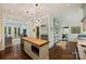 Spacious kitchen with butcher block island, stainless appliances, and easy access to multiple living areas at 2101 Dilworth W Rd, Charlotte, NC 28203