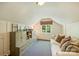 Comfortable living room with a white couch and built-in shelving and drawers for storage at 2101 Dilworth W Rd, Charlotte, NC 28203