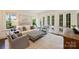 Inviting living room with neutral colors, plush seating, and French doors leading to the backyard at 2101 Dilworth W Rd, Charlotte, NC 28203