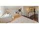 An upstairs living room with neutral colored couches and chairs is lit by a charming chandelier at 2101 Dilworth W Rd, Charlotte, NC 28203