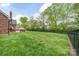 Spacious backyard with lush green grass and fence at 2104 Planters Knoll Dr, Monroe, NC 28110