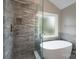 Beautiful bathroom featuring a freestanding tub and a glass enclosed shower with nice tile at 2104 Planters Knoll Dr, Monroe, NC 28110