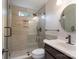 Modern bathroom with glass shower, neutral tile, and sleek fixtures at 2104 Planters Knoll Dr, Monroe, NC 28110