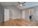 Vaulted ceiling bedroom with hardwood floors, ceiling fan, and easy bath access at 2104 Planters Knoll Dr, Monroe, NC 28110