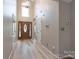 Welcoming foyer with hardwood floors, a high ceiling, and a decorative front door at 2104 Planters Knoll Dr, Monroe, NC 28110