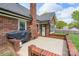 Brick patio with grill, perfect for outdoor entertaining at 2104 Planters Knoll Dr, Monroe, NC 28110