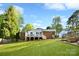 Large open backyard with a deck and patio space, perfect for outdoor gatherings at 2121 Arnold Dr, Charlotte, NC 28205