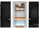 Walk in closet features custom built-in shelving and cabinets at 2121 Arnold Dr, Charlotte, NC 28205