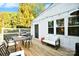 Spacious outdoor deck with seating, grill, and string lights for relaxing evenings at 2121 Arnold Dr, Charlotte, NC 28205