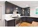 Stylish kitchen boasts dark cabinetry, stainless steel appliances, and ample counter space at 2121 Arnold Dr, Charlotte, NC 28205