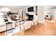 Bright and airy living room with hardwood floors, a fireplace, built-in shelving, and comfortable seating at 2121 Arnold Dr, Charlotte, NC 28205