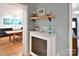 Cozy living space with hardwood floors, with a glimpse of the kitchen, with stylish décor at 2121 Arnold Dr, Charlotte, NC 28205