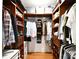 Spacious walk-in closet with custom wood shelving and ample storage for clothes at 2121 Arnold Dr, Charlotte, NC 28205
