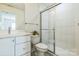 Bathroom featuring a glass-enclosed shower, white cabinets, and a tiled floor at 2124 Barrowcliffe Nw Dr, Concord, NC 28027