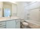 Well-lit bathroom with a vanity, toilet, and a bathtub with a shower at 2124 Barrowcliffe Nw Dr, Concord, NC 28027