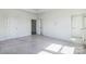Spacious, unfinished bedroom features multiple doors and natural light at 2124 Barrowcliffe Nw Dr, Concord, NC 28027
