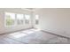 Bright, unfinished bedroom with large windows and natural light at 2124 Barrowcliffe Nw Dr, Concord, NC 28027