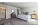Bedroom featuring neutral carpet, a queen bed, and an ensuite bathroom entrance at 2124 Barrowcliffe Nw Dr, Concord, NC 28027