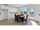 Open dining area features a modern table with seating and bright white cabinets at 2124 Barrowcliffe Nw Dr, Concord, NC 28027