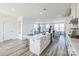 Gourmet kitchen boasts an island with seating, stainless appliances and opens to the living area at 2124 Barrowcliffe Nw Dr, Concord, NC 28027