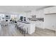 Open concept kitchen features an island with seating and modern stainless steel appliances at 2124 Barrowcliffe Nw Dr, Concord, NC 28027