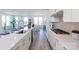 Bright, open kitchen features an island with seating and stainless steel appliances at 2124 Barrowcliffe Nw Dr, Concord, NC 28027