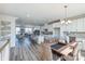 Open concept living space with wood floors and view of a modern kitchen at 2124 Barrowcliffe Nw Dr, Concord, NC 28027