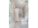 Bathroom featuring tiled shower/tub combo, marble floors, and natural light from a window at 2221 Hamilton Mill Rd, Charlotte, NC 28270
