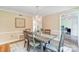 Elegant dining room featuring a decorative chandelier, area rug, and wooden table with seating for six at 2221 Hamilton Mill Rd, Charlotte, NC 28270