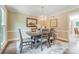 Elegant dining room with stylish table, chairs, chandelier, and trim at 2221 Hamilton Mill Rd, Charlotte, NC 28270