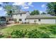 Back of the house featuring an attached garage and well-manicured lawn at 2221 Hamilton Mill Rd, Charlotte, NC 28270