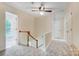 Upstairs hallway filled with natural light, with carpet floors at 2221 Hamilton Mill Rd, Charlotte, NC 28270