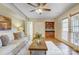 Bright living room with French doors, a built-in wet bar, hardwood floors, and neutral furniture at 2221 Hamilton Mill Rd, Charlotte, NC 28270
