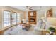 Cozy living room with a brick fireplace, French doors, and neutral decor providing a relaxing atmosphere at 2221 Hamilton Mill Rd, Charlotte, NC 28270