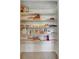 Walk-in pantry with ample shelving for organized storage of food items, cookware, and kitchen essentials at 2221 Hamilton Mill Rd, Charlotte, NC 28270