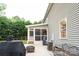 Exterior view showcasing the screened porch and a portion of the house at 260 Ingonish Dr, Gastonia, NC 28056