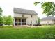 Spacious backyard features a screened-in porch and a seating area with a firepit at 260 Ingonish Dr, Gastonia, NC 28056