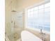 Bright bathroom features a large glass shower and soaking tub at 260 Ingonish Dr, Gastonia, NC 28056