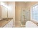 Bright bathroom features a large glass shower and soaking tub at 260 Ingonish Dr, Gastonia, NC 28056