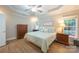 Charming bedroom with a ceiling fan, a decorative sign, and lots of natural light at 260 Ingonish Dr, Gastonia, NC 28056