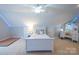 Well-lit bedroom features a makeup table, a bed, white furniture, and accent lighting at 260 Ingonish Dr, Gastonia, NC 28056