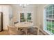 Bright dining area with a view to the back yard through white french doors at 260 Ingonish Dr, Gastonia, NC 28056