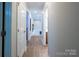 Spacious hallway leading to bedrooms and bathrooms with wood floors at 260 Ingonish Dr, Gastonia, NC 28056