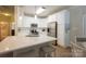 Modern kitchen featuring stainless steel appliances and a quartz countertop island with seating at 260 Ingonish Dr, Gastonia, NC 28056