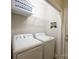 Bright laundry room features a full-size washer and dryer at 260 Ingonish Dr, Gastonia, NC 28056